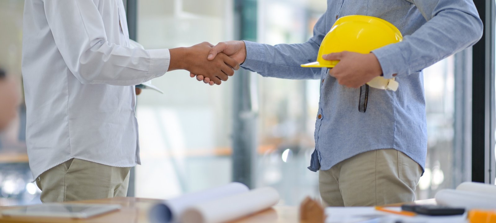 Architects and contractors shake hands to work. Architects and contractors shake hands to work.
