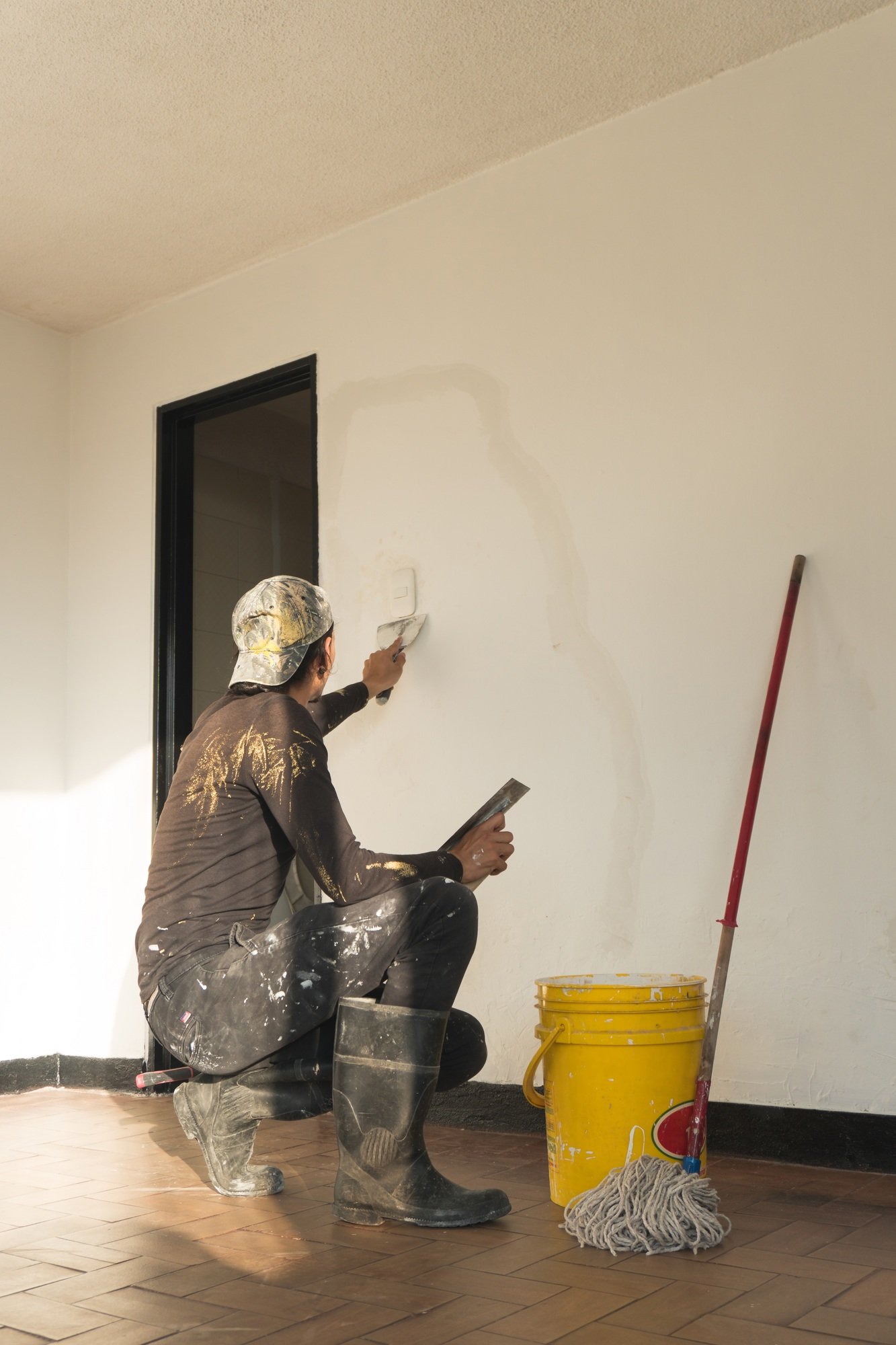 man making repairs in his house. home renovation. man making repairs in his house. home renovation.